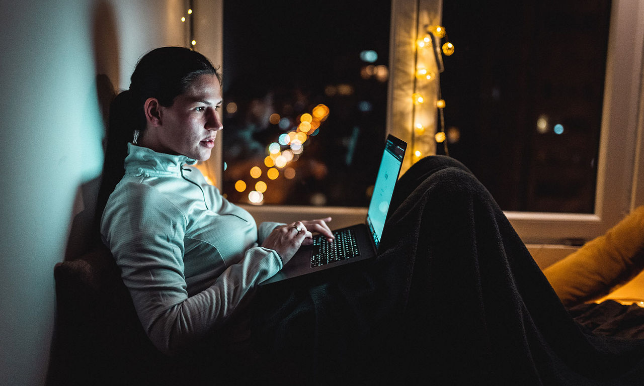 Woman sitting on laptop